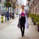 A Fashionable Woman Walking on the Sidewalk