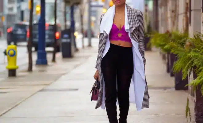 A Fashionable Woman Walking on the Sidewalk