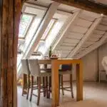 brown wooden dining table with two gray seats near opened window